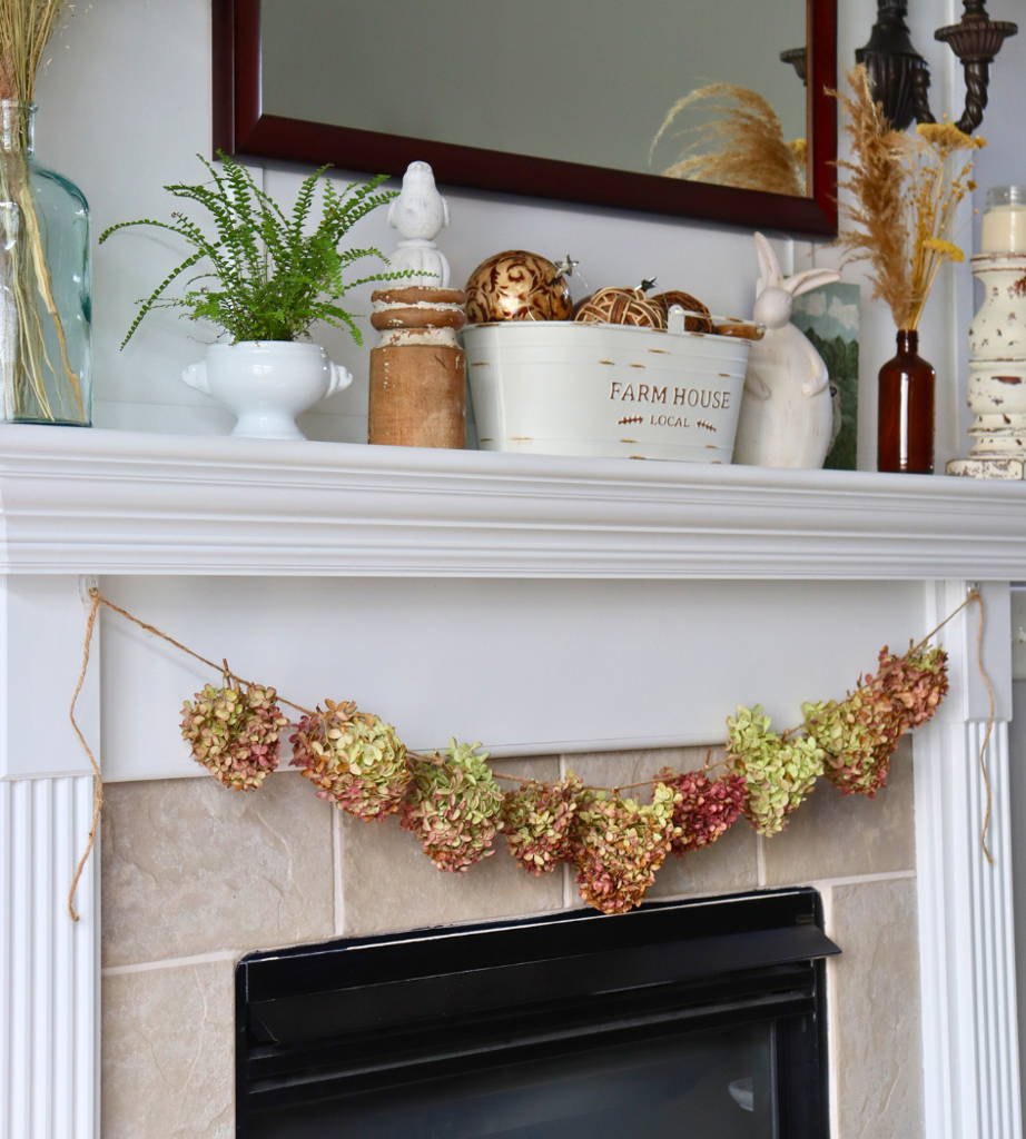Colorful hydrangea garland hanging on a fireplace